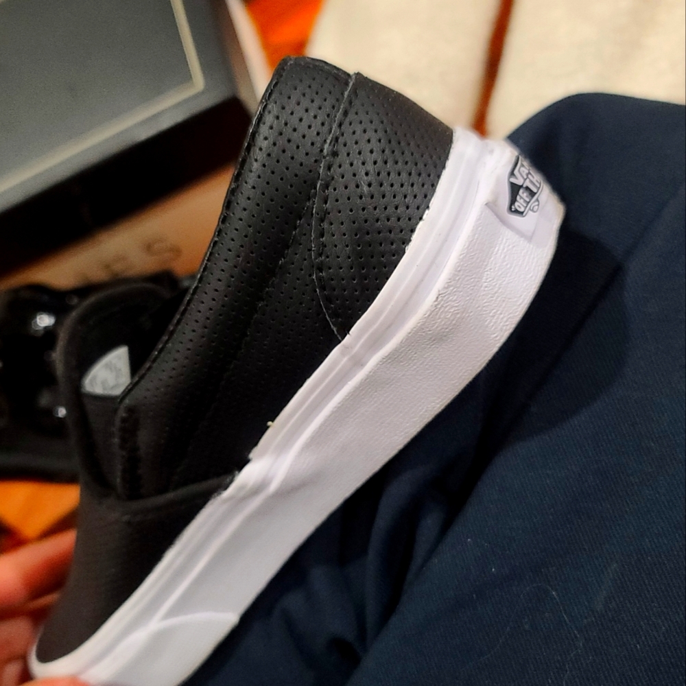 Vans black leather slip ons
